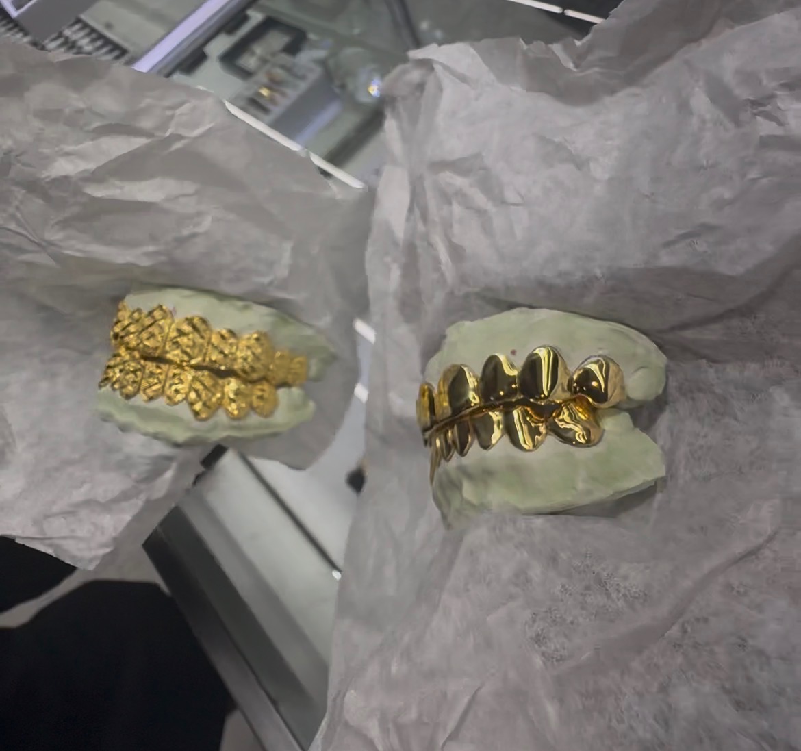Two custom gold grill sets on the bench
