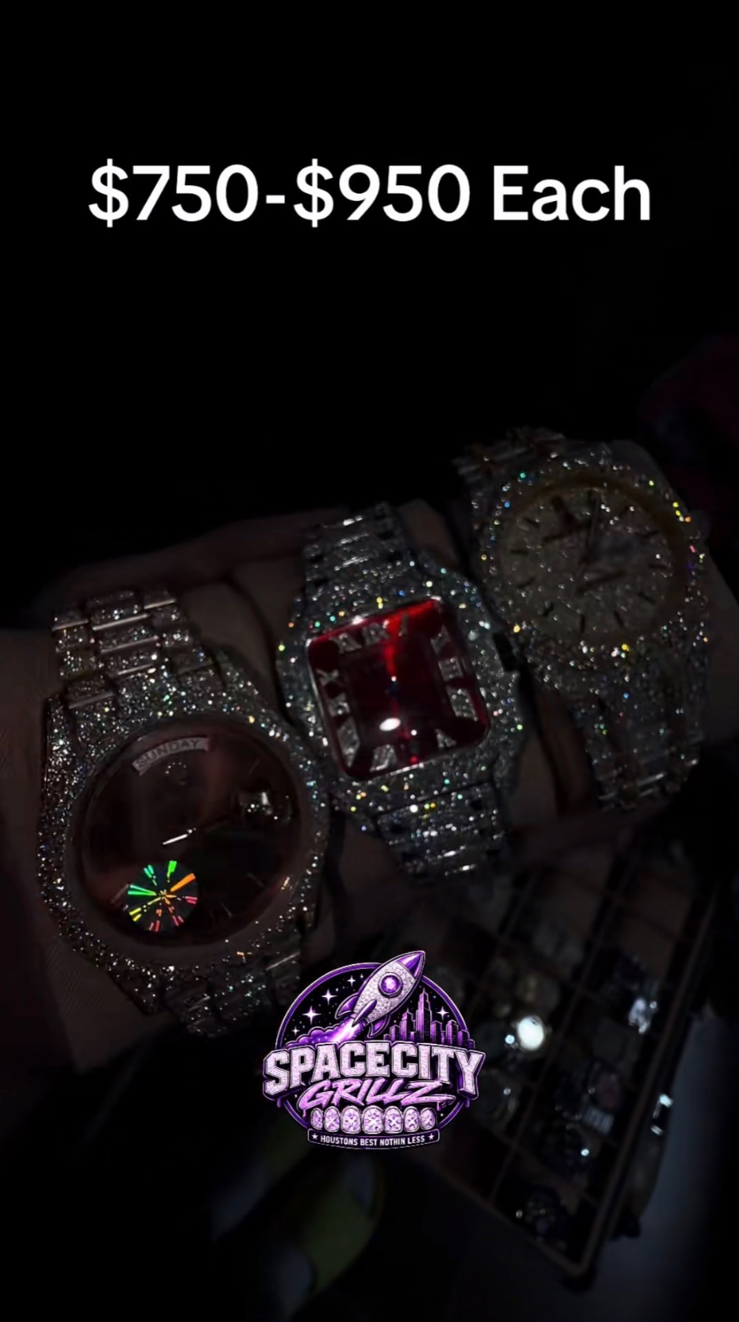 Three iced-out wristwatches in rose gold, silver, and yellow gold held over a dark background
